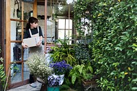 Woman working in her flower shop