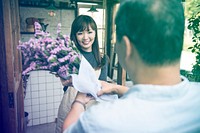 Customer comes to pick up the bouquet from flower shop