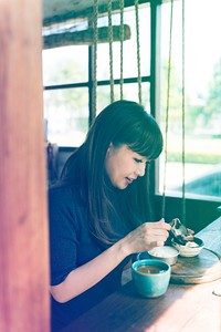 Photo Gradient Style with Woman Traditional Drinking Tea Relax in the Cafe