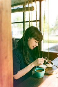 Photo Gradient Style with Woman Traditional Drinking Tea Relax in the Cafe