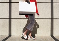 Woman walking around with shopping bag
