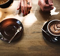 Coffee foam froth art on wooden table