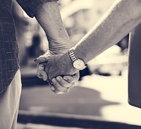 Mature people romantic holding hands