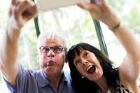 Mature couple taking selfie together
