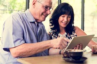 Couple using tablet browsing together