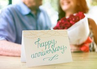 Happy Anniversary card with the couple in the background