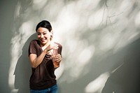 Young student holding a beverage