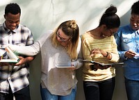 Group of college students studying for examination