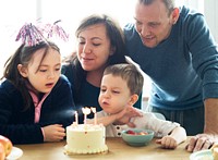 Kid celebrating birthday with his family