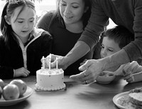 Kid celebrating birthday with his family