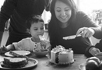 Family celebrating their son's birthday