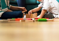 Children having fun playing toy blocks