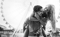 Couple having a sweet time together in an amusement park