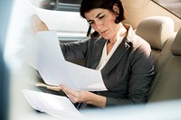 Businesswoman Busy Working Car Inside