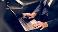 Business People Using Laptop Networking Car Inside