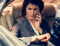 Businesswoman Talking Using Phone Car Inside