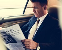 Businessman Reading Newspaper Car Inside