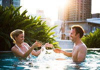 Lovely couple having a great time on a swimming pool