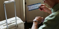 Senior Man Hands Hold Plan Ticket Luggage