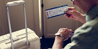 Senior Man Hands Hold Plan Ticket Luggage