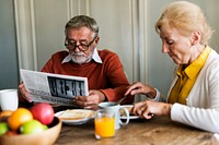 Elderly couple having breakfast