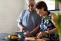 Senior couple cooking together in the kitchen