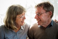 Loving old couple smiling at each other