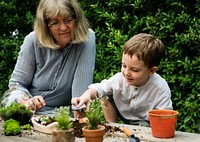 Grandmother gardening with grandson