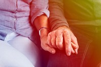 lovely senior adult sweet couple holding hand together