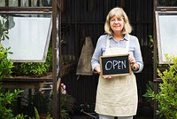 Old caucasian woman with open sign