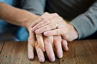 Old couple hands holding each other