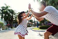 Daughter and dad doing a high five