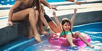 Little girl enjoying the pool on a summer float