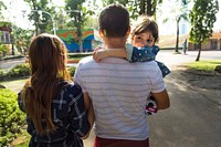 Family strolling together at a park