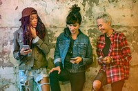 Group of girlfriends connected by mobile phone network
