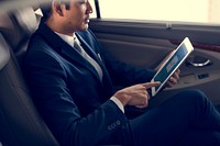 Businessman Use Tablet Inside Car