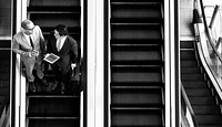 Businessmen on the escalator