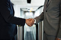 Corporate businessmen shaking hands