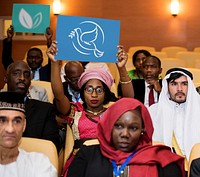 A Group of International Delegates Are Showing Symbol of Peace and Environment 