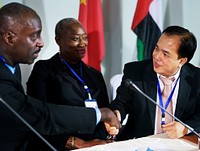 A Small Group of Business People Signing Hands