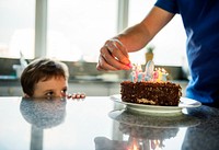 Boy celebrating his birthday with a cake