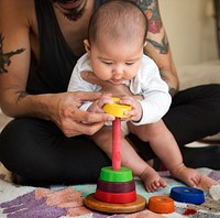 Baby Playing Wooden Toy with Daddy