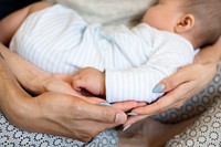 Closeup of family hands holding each other with love