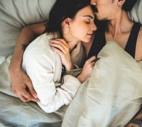 Couple napping on the bed