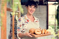 Woman with bread at pastry shop order