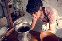 Woman barista making coffee service