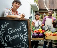 Diverse People with Grand Opening Sign First Day of Business