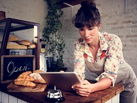 Woman using tablet for online business order