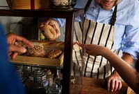 Customers choosing bread in the baker's house