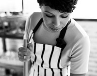 African descent woman cleaning  a store grayscale